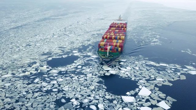 Aerial view of container ship in the sea at winter time