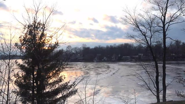 4k Beautiful winter landscape at sunset on frozen lake, Paw Paw Michigan