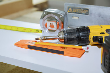 Construction Tools With Blueprint On Wooden Desk