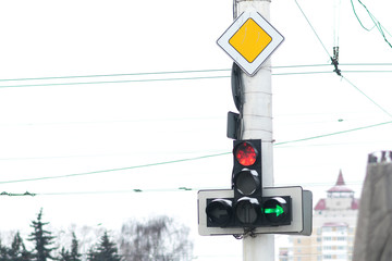 A traffic light with a burning red signal