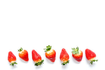 Strawberry with leaves close-up macro isolated on white background