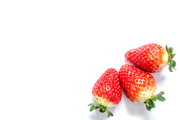 Strawberry with leaves close-up macro isolated on white background