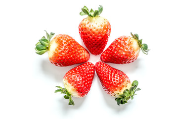 Strawberry with leaves close-up macro isolated on white background