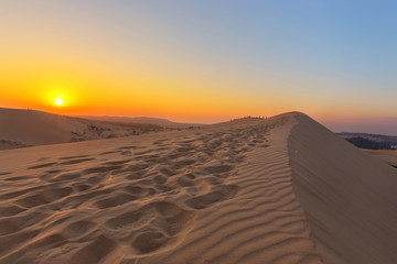 Footprint on the red sand dunes in MUI NE, Vietnam is popular travel destination with long coastline, silver sand and huge sea waves.