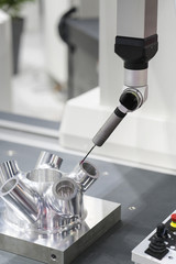 operator inspection automotive parts by CMM