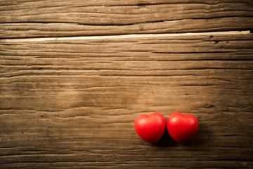 Red heart on wooden table. Concept for valentine day.