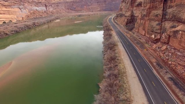Aerial view panning from above road over the Colorado River near Moab Utah.