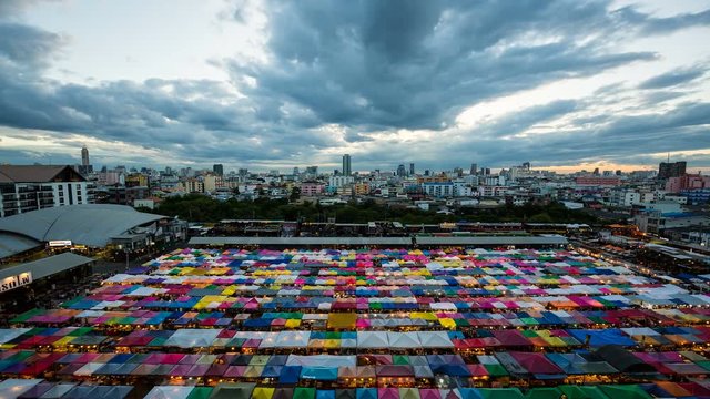Day to night time lapse of Ratchada Railway Night Market, Bangkok, Thailand