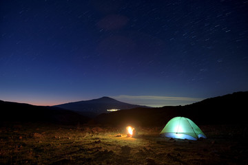 Fototapeta na wymiar Wild Camp And Etna Volcano Under The Starry Sky At Dawn, Sicily