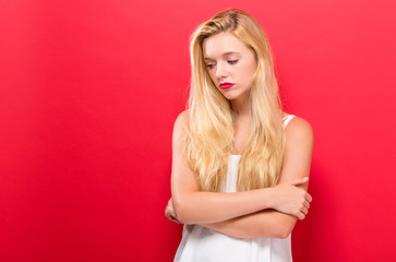 Fototapeta premium Unhappy young woman on a solid background