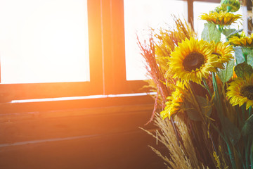 Bouquet of sunflowers on the window at home. concept of natural and decoration.