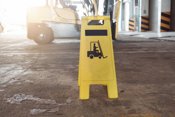 Sign showing warning of caution forklifts at industrial for safety.