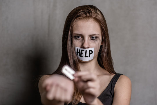 Teen Girl  Cuts Veins On A Hand With A Mouth Taped With The Inscription 