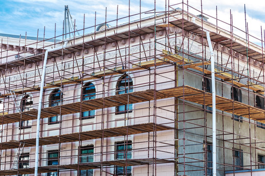 scaffolding on wall of the building for restoration work and renovation of facade