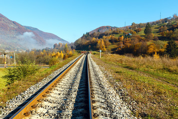 Fototapeta premium Autumn Carpathian mountains and railroad bridge, Ukraine