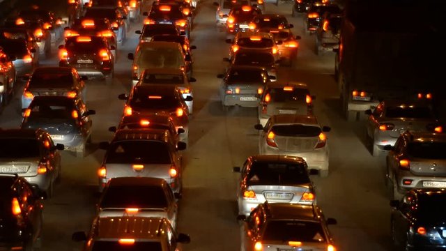 Car traffic jam on the highway. Evening, night, headlight 