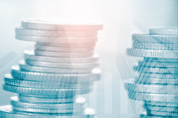 Double exposure of coins and city background, finance and banking concept
