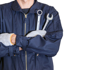 Fototapeta Car repairman wearing a dark blue uniform standing and holding a wrench that is an essential tool for a mechanic isolated on white background. obraz