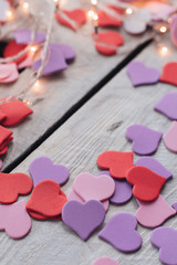 Background for design to Valentine's Day. Decorative red purple ultraviolet hearts. View from above. Valentines Day concept