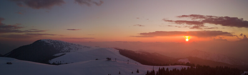 Wonderful drone aerial sunset at the Monte Pora ski area in winter season. Orobie Alps