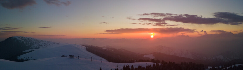Fototapeta premium Wonderful drone aerial sunset at the Monte Pora ski area in winter season. Orobie Alps