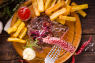 Beef steak with homemade french fries, beer and tartar sauce