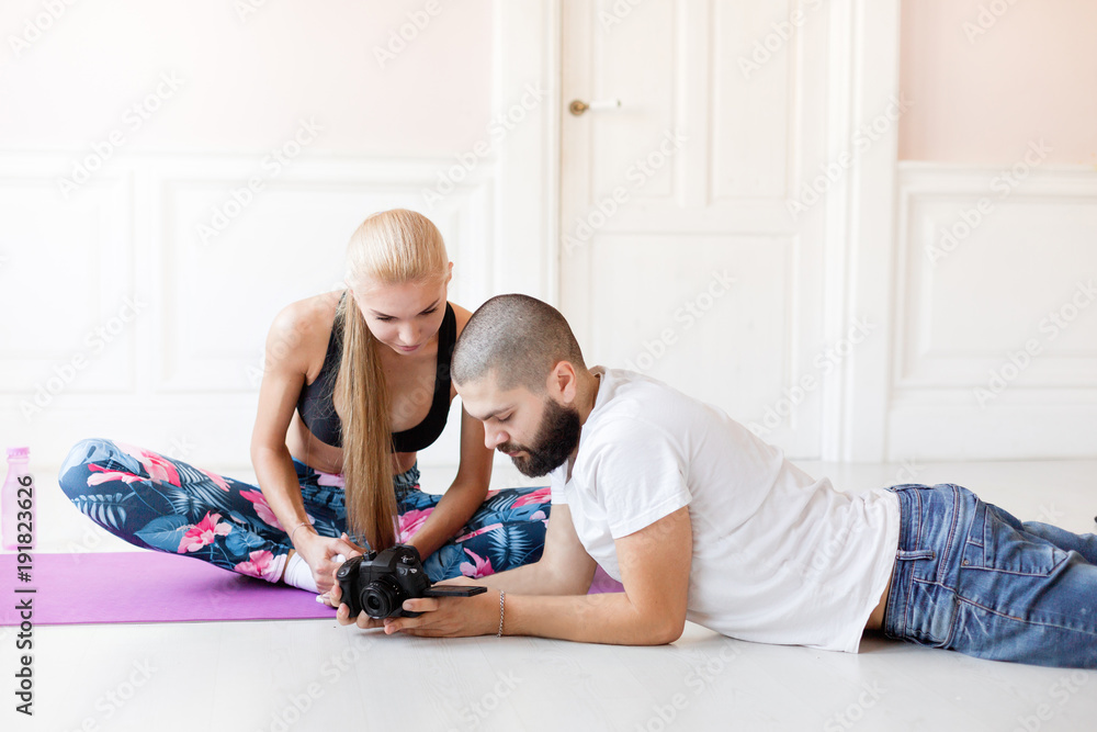 Wall mural videography of a blog or lessons. Lovely young blonde girl. home fitness.