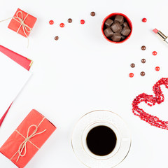 Coffee cup, sweets, lipstick, heart shape and giftbox on white background. Women's Day concept flat lay.