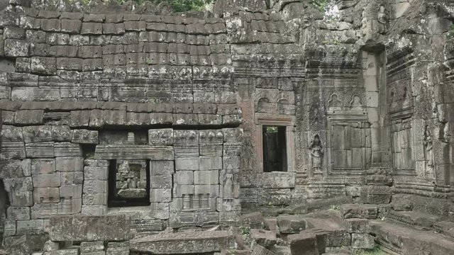 pan of temple walls and female devata at banteay kdei near angkor wat, cambodia