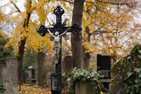 A cross with Jesus Christ in an old cemetery in Prague