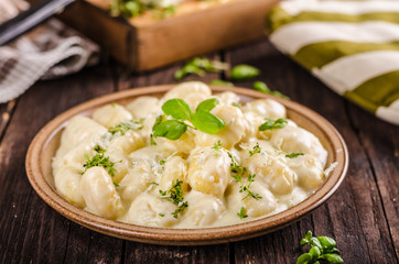 Cheese gnocchi with blue cheese sauce and galic