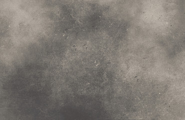 Black gray background of school blackboard monochrome texture. Vignetted aged texture background.