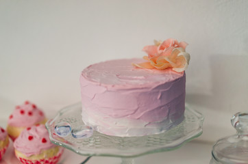 a pink cake is served on a white table for the celebration of St. Valentine's Day