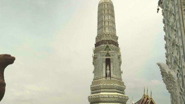 tilt down shot of a smaller satellite prang at wat arun, bangkok, thailand