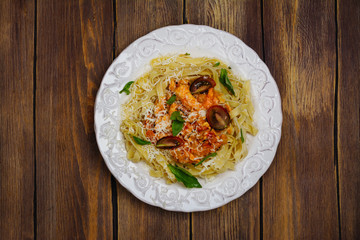 Homemade italian pasta with tomato sauce, chicken, and basil
