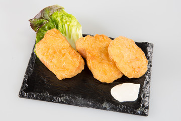 take away breaded chicken fried nuggets wings with bbq dipping sauce