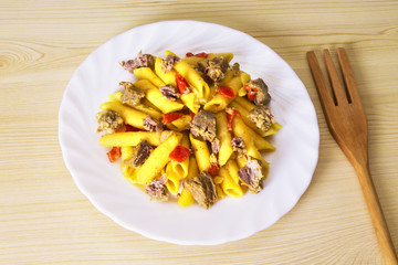 plate of stewed macaroni with meat and tomato