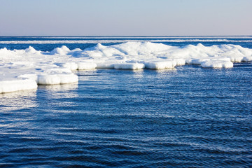 Cold sea, ice in the water.