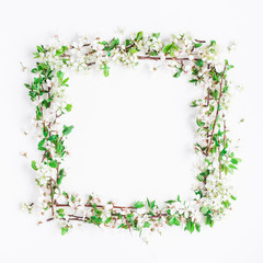 Flowers composition. Frame made of apple tree flowers on white background. Flat lay, top view, copy space, square