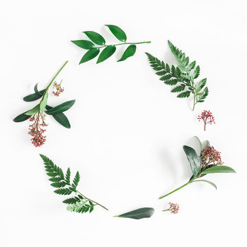 Flowers composition. Wreath made of tropical flowers and leaves on white background. Flat lay, top view, copy space, square