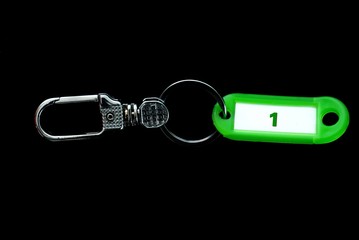 Key holder and green label holder with number one,