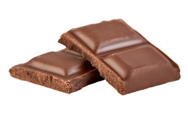Milk chocolate pieces isolated on white background.