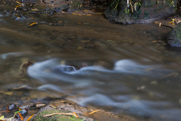 Flowing water in shallow river.
