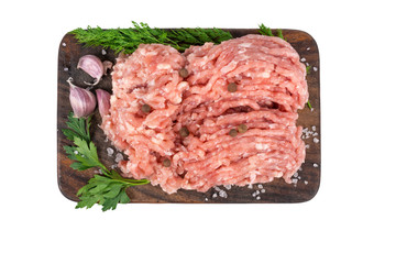raw minced chicken meat on wooden cutting board isolated on white background