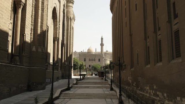 street view of the mosque of sultan hassan and a minaret in cairo egypt