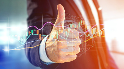 Businessman holding a 3d render Stock exchange trading data information display on a futuristic...