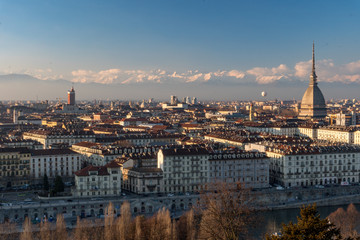 Fototapeta na wymiar Italian City Landscape Of Torino With Alps And The Mole Antonelliana