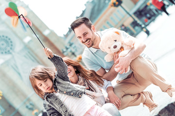 Happy young family spending time together.