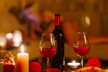 Bottle of red wine and glasses.
