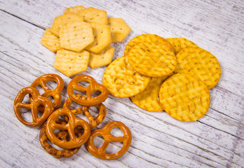 Mix of snacks : pretzels, crackers, cookies.